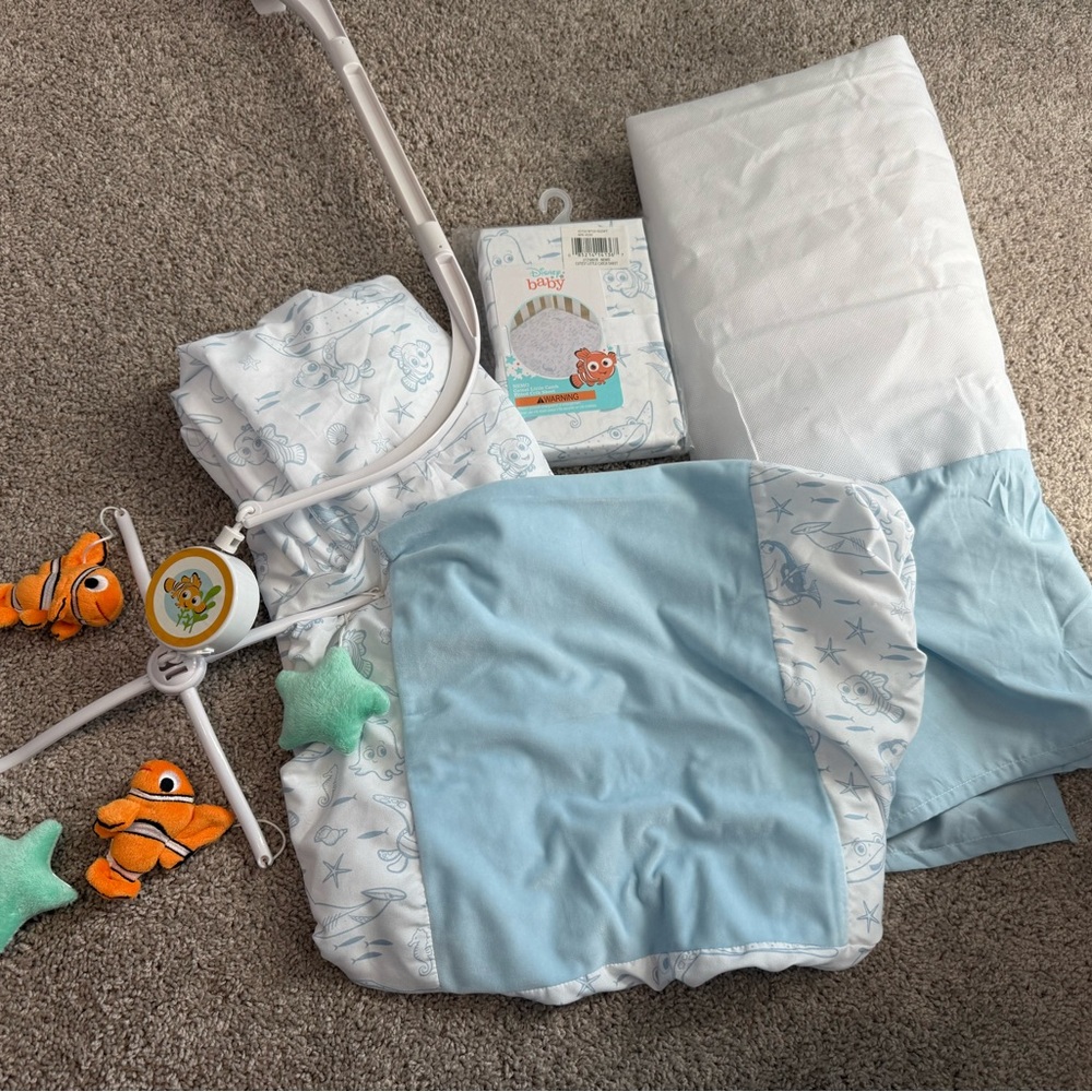 Disney Baby Nemo Crib Sheet Bundle with mobile & changing pad cover